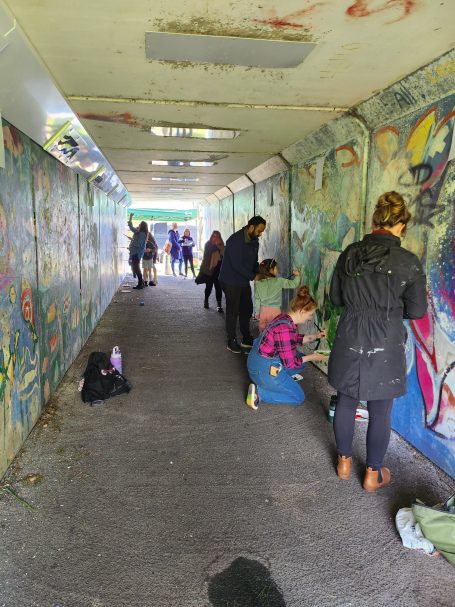Community mural restoration and painting